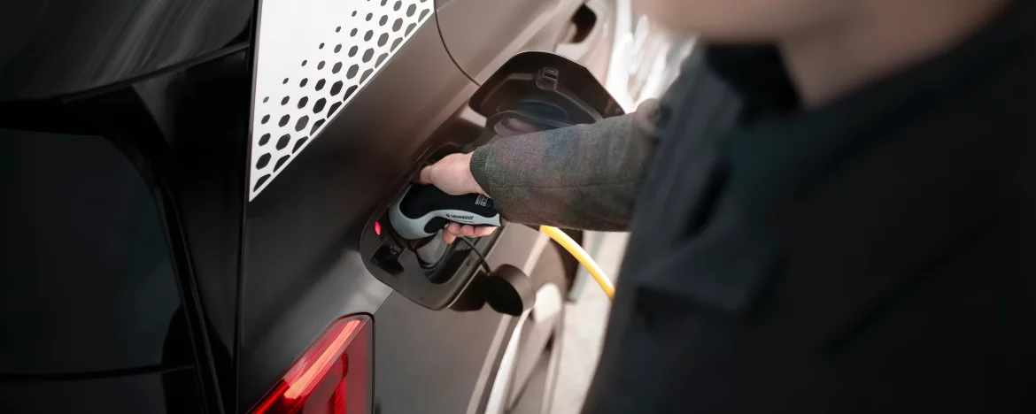 person charging their car